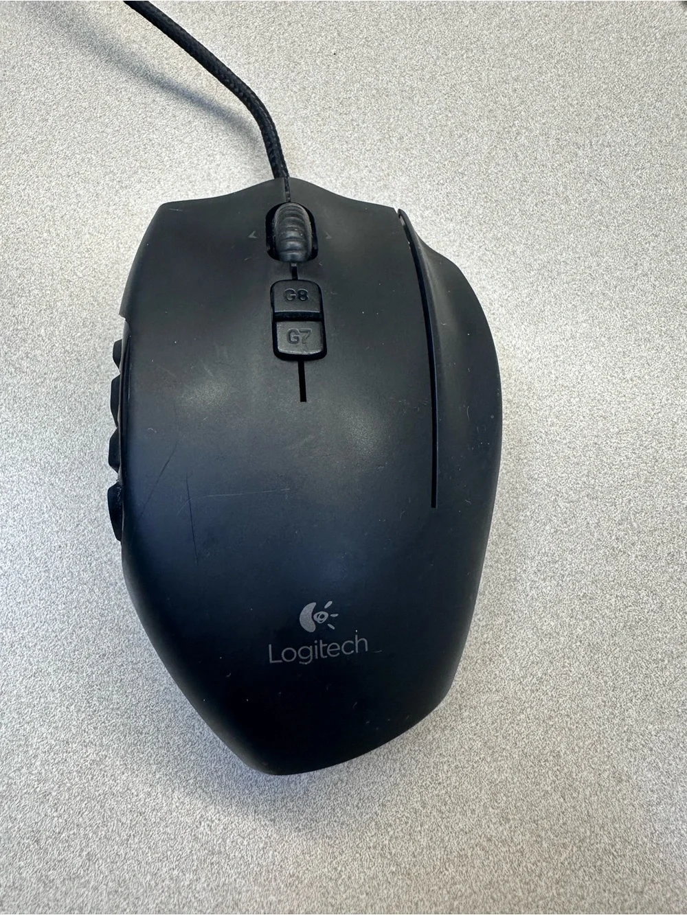 Logitech G600 Black Wired Ergonomic Gaming Mouse with 12 button thumb grid.